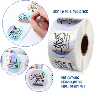 Close-up of rainbow laser Thank You stickers for small business packaging labels