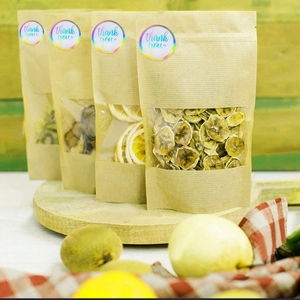 Rainbow laser Thank You stickers on brown kraft paper stand-up pouches with window