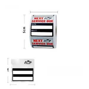 Detail view of 5x5cm oil change reminder stickers roll with next service due labels