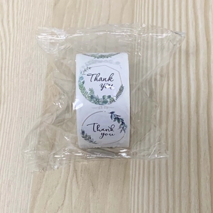 Detailed view of floral Thank You seal stickers roll for handmade craft packaging