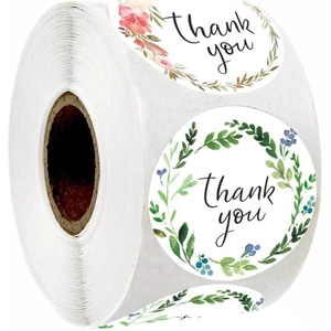 Roll of white round thank you stickers with floral wreaths and botanical greenery design