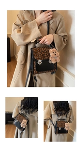 Detail of leopard print patchwork backpack with metal buckles and cute bear charm