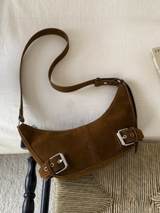 Brown suede hobo shoulder bag with silver buckles and retro crescent design