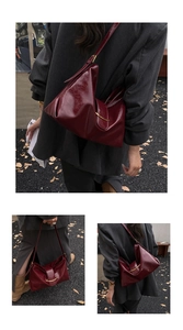Détails du sac cabas en cuir verni bordeaux avec boucles dorées et plis souples