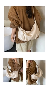 Detail of cream hobo bag showing soft leather texture and long side tassels