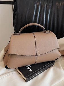 Brown lychee leather handbag with trapezoid shape and top handle for women