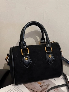Retro black quilted suede Boston bag with gold hardware and top handle for women