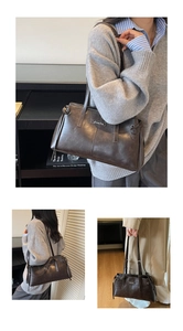 Detail of dark brown leather tote bag with Sunny Day metal logo and textured finish