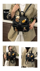 Close-up of black PU leather backpack with decorative plush food patches and twin pockets
