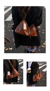 Close-up of glossy brown patent leather shoulder bag featuring a white lettered hangtag