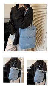 Close-up of light blue quilted tote bag showing waterproof fabric and large front pocket