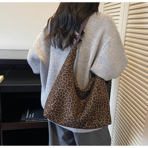 Detailed view of vintage leopard print tote bag showing texture and large capacity