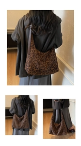 Detail view of large leopard print hobo bag showing adjustable metal buckle and texture