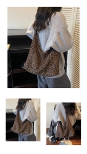 Detail shot of vintage leopard print suede shoulder bag with spacious crescent shape design