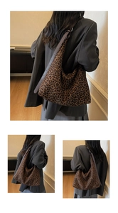 Detail shot of leopard print suede hobo bag with deep brown long shoulder strap