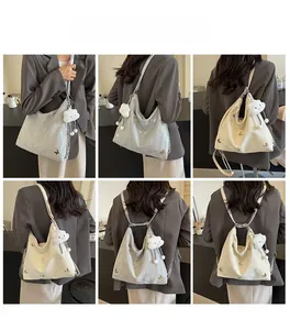 Detailed views of versatile large capacity handbag with butterfly embroidery and cloud charm