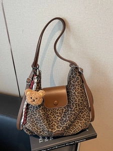 Leopard print large tote bag with brown faux leather trim and cute bear charm pendant