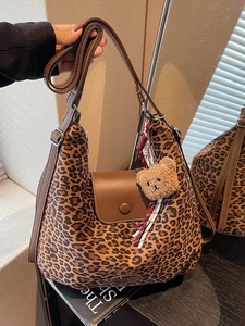 Large leopard print tote bag with brown leather trim and cute bear charm pendant