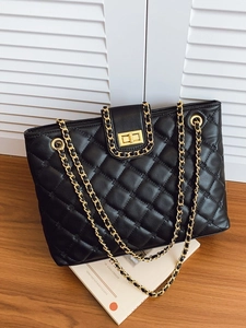 Classic black quilted leather tote bag with elegant gold chain strap and turn-lock closure