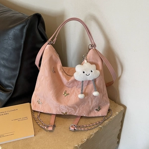 Pink pleated large capacity shoulder bag with metal butterfly and plush charm detail