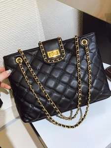 Classic black quilted leather tote bag featuring gold chain straps and a twist-lock clasp