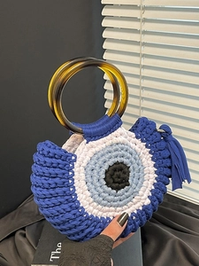 Handmade crochet Evil Eye handbag with blue fringe and stylish tortoiseshell resin handles