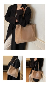 Detail of khaki tote bag with matte texture, leather pocket and silver chain strap