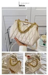 Detail of white quilted handbag showing gold chain strap and metal frame clasp