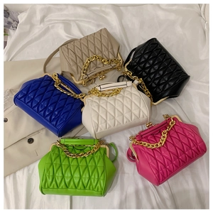 Quilted crossbody bags with vintage gold chains and metal clasps in six vibrant colors