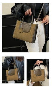 Close-up of vintage tote bag featuring brown leather and camel suede patchwork details