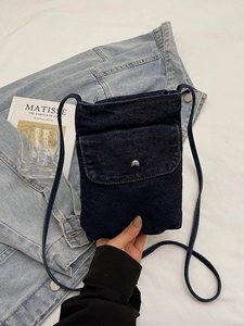 Deep blue denim mini crossbody bag with metal buckle and slim shoulder strap