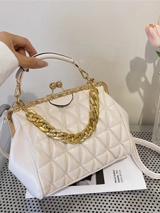 Vintage white quilted handbag with gold chain strap and kiss-lock closure for women