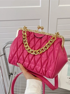 Vintage rose red quilted handbag with gold chain handle and floral metal clasp frame