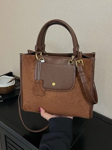 Minimalist brown suede tote bag with top handles and adjustable strap for women