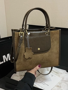 Retro tote bag in dark brown suede and green leather with adjustable shoulder strap
