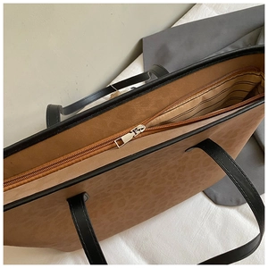 Top view of large leopard print tote bag showing zipper closure and spacious interior