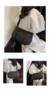 Detailed views of a black nylon messenger bag with buckle flap and adjustable strap