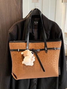 Vintage leopard print tote bag in brown suede with black straps and plush charm