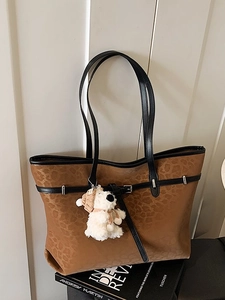 Retro brown leopard print tote bag with black handles and teddy bear pendant