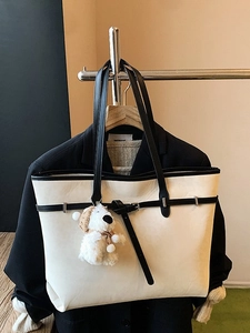 Retro large capacity beige tote bag with black contrast straps and plush puppy pendant