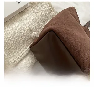 Detail shot of a dark coffee tote bag showing durable wear-resistant leather base