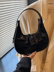 Minimalist black crocodile embossed hobo bag with glossy finish and top handle for women