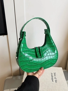 Emerald green crocodile pattern dumpling hobo bag with glossy finish and double zippers