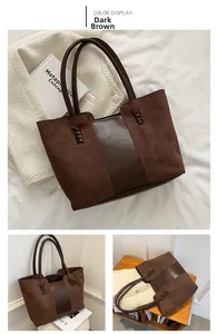 Detail view of large dark brown tote bag with suede leather textures and braided rope accent
