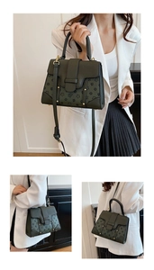 Detail of olive green vintage leather handbag with floral bee embossing and gold hardware