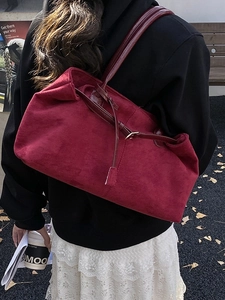 Retro burgundy suede tote bag with large capacity shown in a stylish street style shot