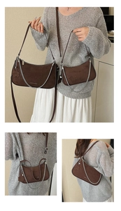 Detail of brown suede crescent bags with silver chain and adjustable shoulder straps