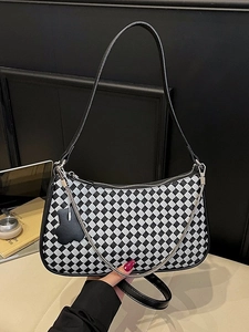 Chic black and white checkerboard hobo bag with slim leather strap and silver chain detail