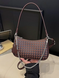 Brown woven leather shoulder bag with silver chain and cute bear charm detail