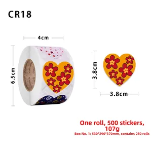 Detail view of 3.8cm heart stickers with red flower pattern on a 500-piece roll